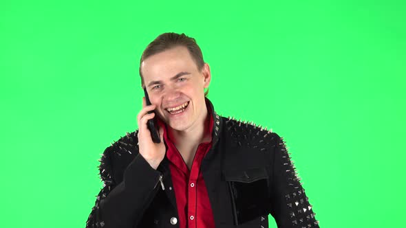 Guy Talking for Mobile Phone and Rejoice. Green Screen