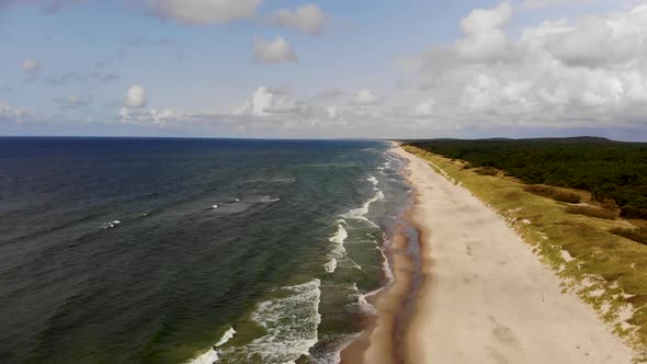 Flying very high over sunny Baltic Sea beach