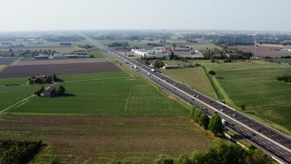 Italian highway traffic with green meadow countryside