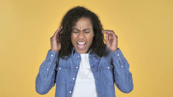 Screaming Angry African Girl Isolated on Yellow Background