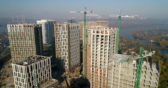 Landscape in the City with Under Construction Buildings and Industrial Cranes