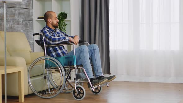 Unhappy Man in Wheelchair