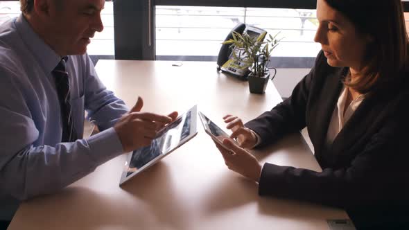 Business people using digital tablet