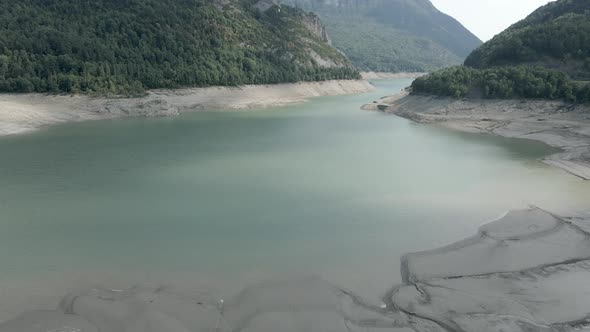 Drone Shot of Receded Water Levels of Lake Ayous and Beautiful Lush Green Pine Forest By It's Banks