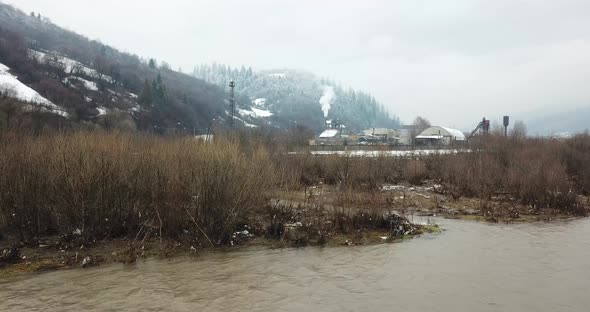 Woodworking Plant Near a Mountain River Environmental Pollution