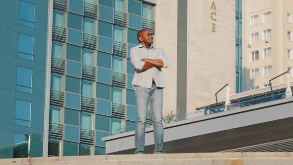 Elderly Man Tourist Wearing Casual Clothes Shirt and Jeans Standing on Blue Modern Office Building