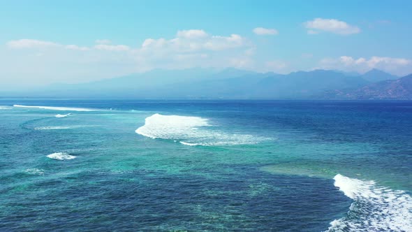 Tropical aerial clean view of a white sand paradise beach and blue water background in colourful 