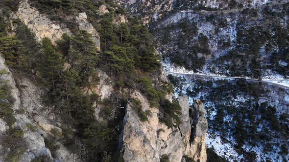 Aerial View of a Rocky Wall in the Mountains Covered with Juniper