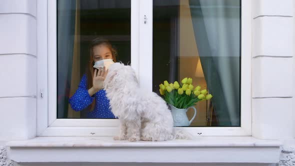 A Self-isolate child or Quarantine Looking Out Window Home