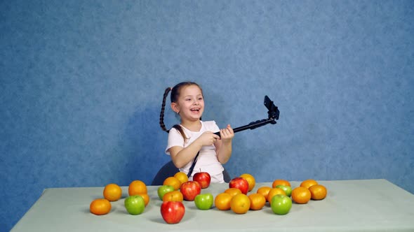 Girl Making Selfie with Fruits