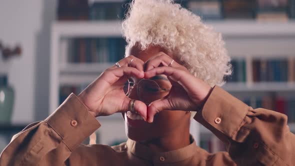 African American Woman Demonstrates Gesture Heart From Fingers Love Symbol