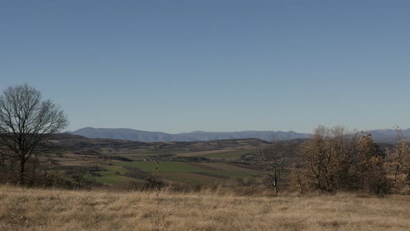 Landscape in Eastern Serbia slow tilt 4K 2160p 30fps UltraHD footage - Tilting on hills by the day 3