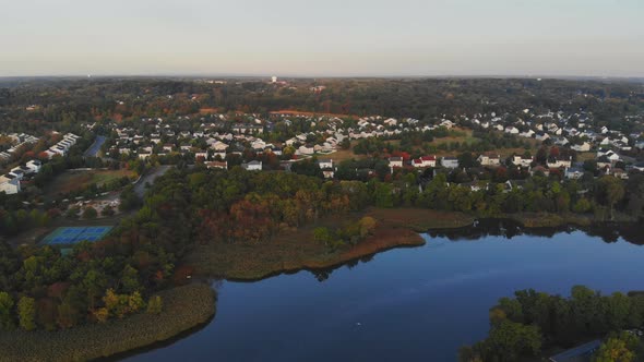 Aerial View of Residential Town Areas Along the River with Private Houses Bench in Autumn Landscape
