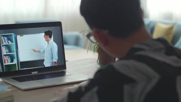 Teen Boy Student Distance Learning With Online Teacher On Computer Screen, Web Tutor