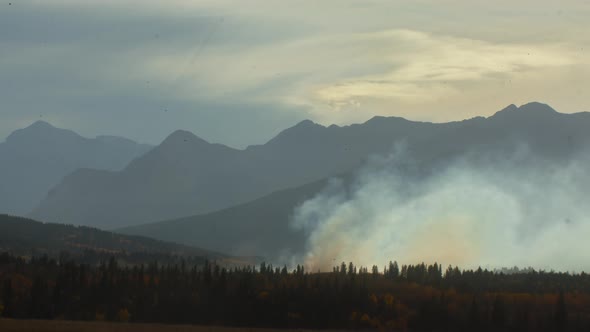 Fire distant in the mountains pan