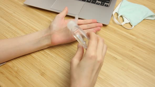 Woman Uses an Antibacterial Hand Sanitizer and Wears Protective Mask Finished Her Work