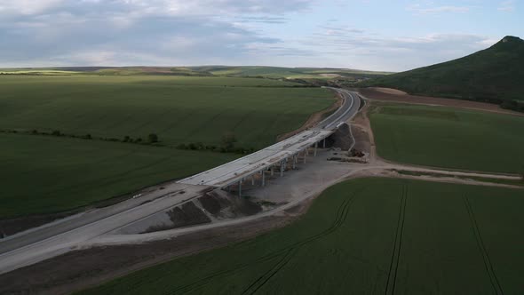 Drone flight over beautiful nature and a newly built highway