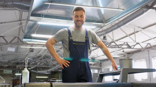 Portrait of an Engineer on a Printing Factory