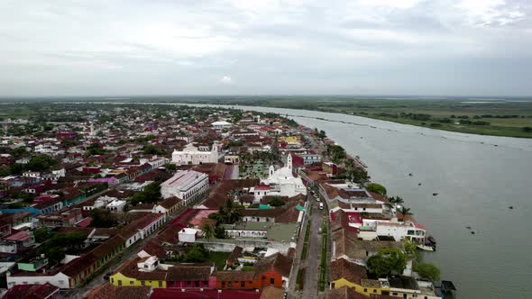 rotational drone shot of the main square and the papaloapan river in tlacotalpan, veracruz, mexico