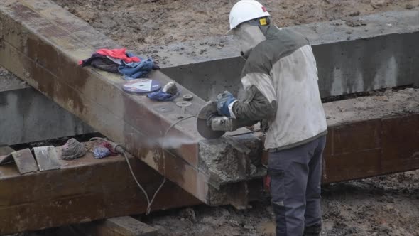 Angular Saw Grinding Through Construction Piles at Construction Site