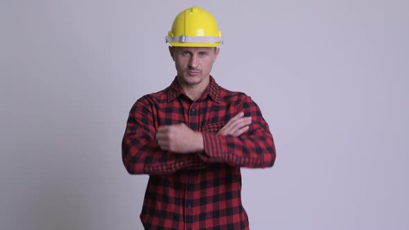 Happy Bearded Man Construction Worker Smiling with Arms Crossed