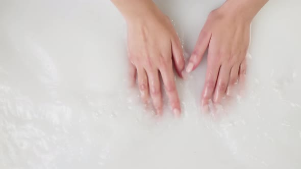 Hands Touching Water Closeup