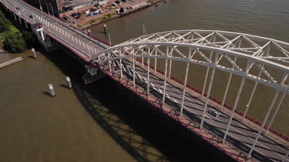 Drone Over Arch Bridge With Traffic In Noord River Near Hendrik ido ambacht, Alblasserdam In The Net