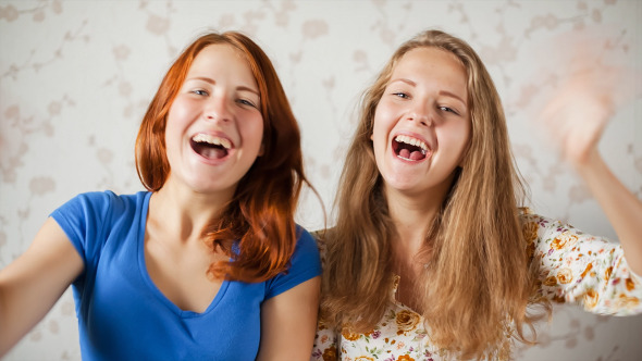 Two Girls Communicates by Webcam alt