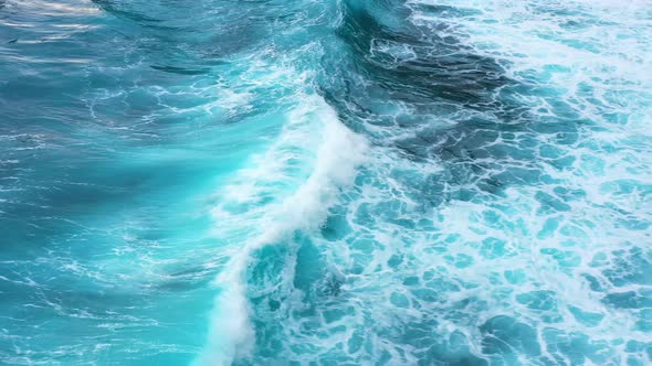 Indonesia. Waves and azure water as a background. View from drone at the ocean surface. 