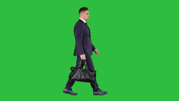 Busy man walking on street with briefcase on a Green Screen