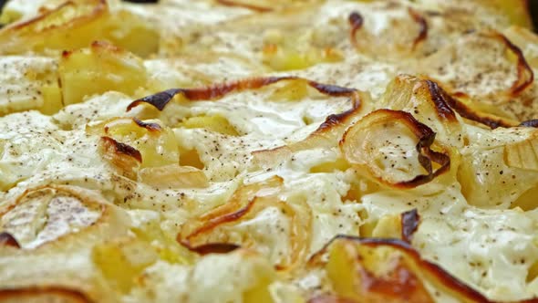 Roasted Potatoes with Onions with Spices and Cheese Close Up