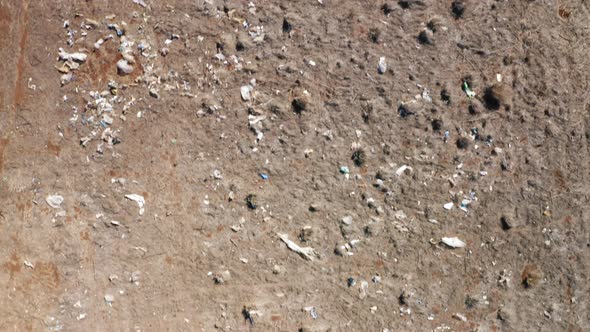 Top Down View Garbage From Landfill Polluting Countryside Field