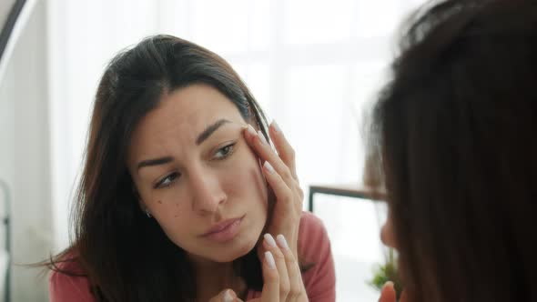 Slow Motion of Attractive Lady Removing Blackheads From Skin Looking at Mirror in Bathroom