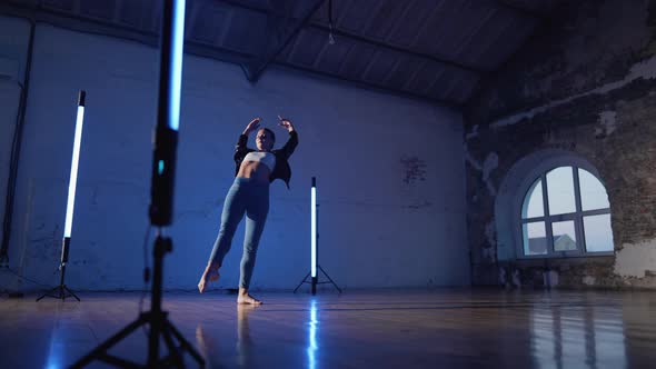 Young Woman in Jeans and Jacket Practicing in Contemporary Dance