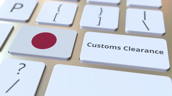 CUSTOMS CLEARANCE Text and Flag of Japan on the Keyboard