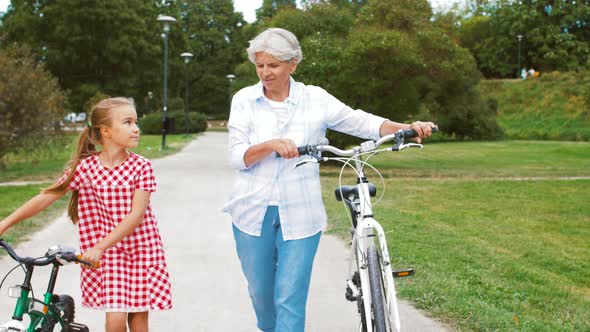 Grandmother and Granddaughter with Bicycles 