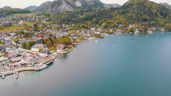 Aerial View of Mountain Lake Wolfgangsee with Houses of Resort Town in Austria, Alps