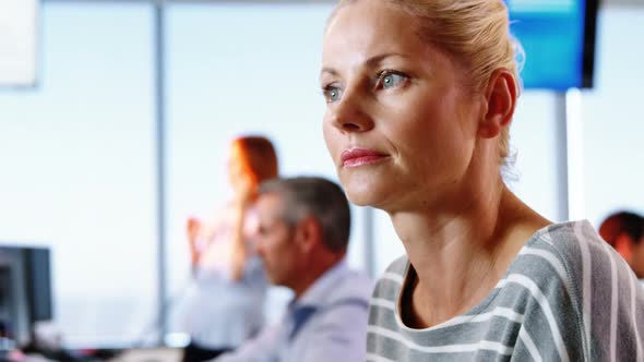 Female executive working at desk