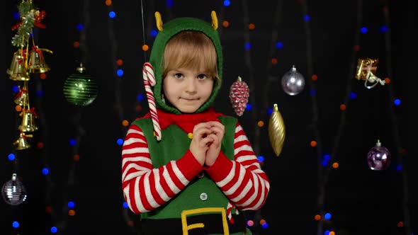 Kid Girl Christmas Elf Santa Helper Steepls Fingers Waiting for Gift Box