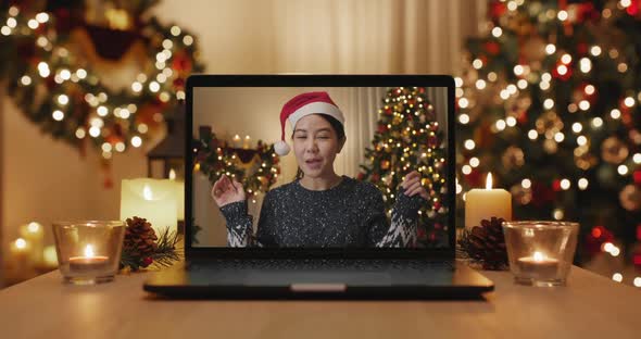Merry Xmas eve festive virtual wishing online message laptop screen.