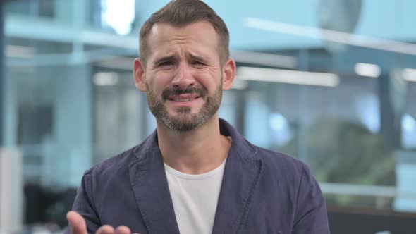 Excited Middle Aged Businessman Reacting to Loss