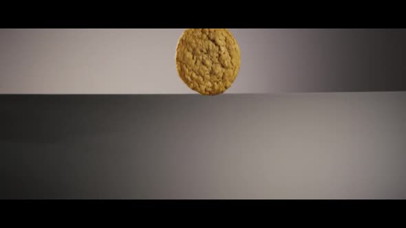 Falling cookies from above onto a reflective surface - COOKIES