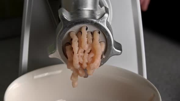 Cooking Minced Meat on an Electric Meat Grinder From Meat Closeup