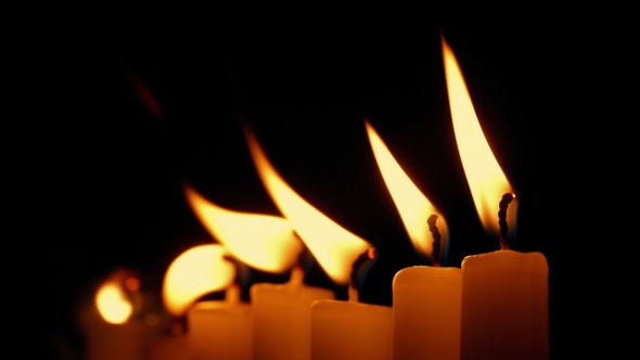 Row Of Candles Blown Out In The Dark Closeup