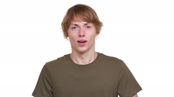Portrait of Fairhaired Guy Isolated Over White Background Angrily Screaming on Camera Gesturing