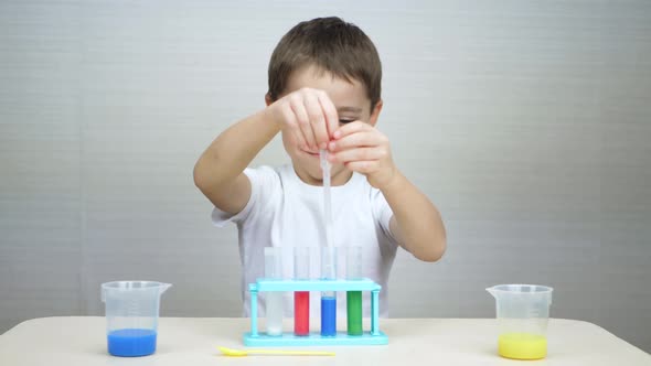 A Happy Child Learns the Reactions of Chemicals