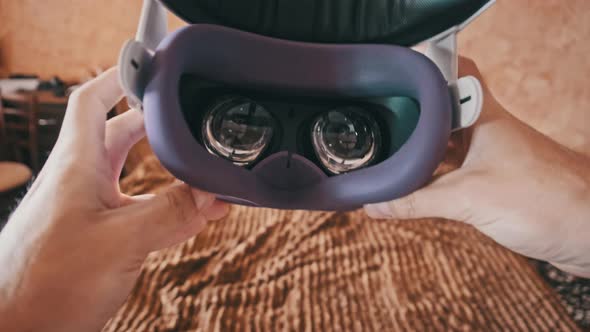 POV of Putting on VR Glasses Virtual Reality in the Bedroom