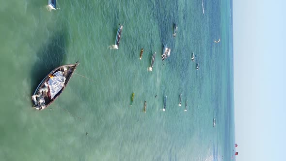 Tanzania Vertical Video  Boat Boats in the Ocean Near the Coast of Zanzibar Aerial View