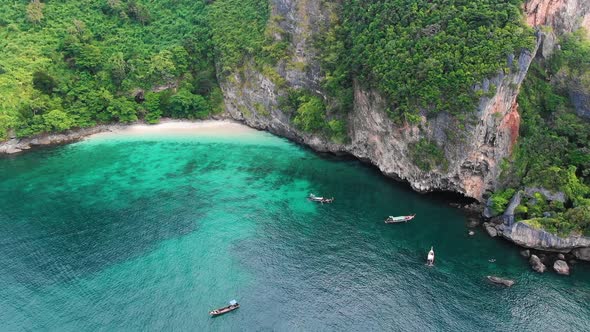 Nature of green island beach with boats on sea aerial view