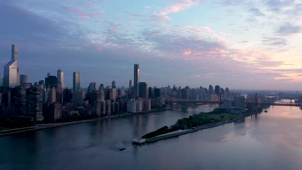 Roosevelt Island and midtown manhattan aerial view at sunrise